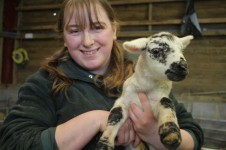 Lisa holding newborn lamb